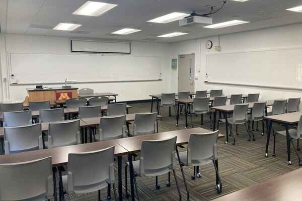 Front of room view with lectern on left in front of chalkboard