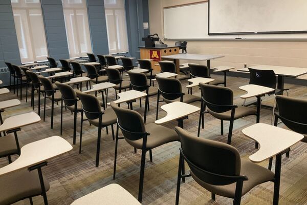 Front of room view with lectern on left in front of markerboard 