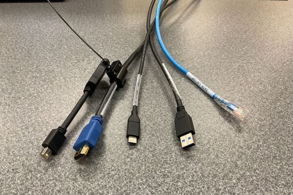 Pedestal - laptop cable connections with cables pulled out showing cable ends