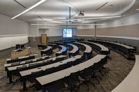 Front of room view with lectern center in front of markerboard 