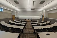 Front of room view with lectern center in front of markerboard 