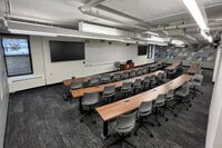 Front of room view with lectern in front of markerboard