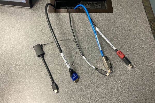 Pedestal - laptop cable connections with cables pulled out showing cable ends