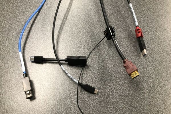 Pedestal - laptop cable connections with cables pulled out showing cable ends