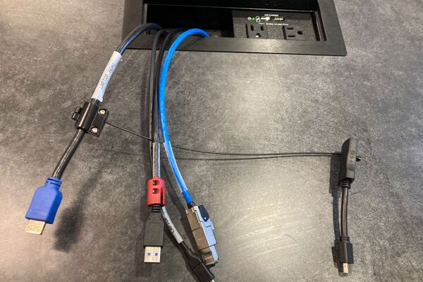 Pedestal - laptop cable connections with cables pulled out showing cable ends