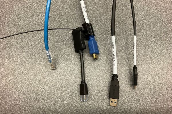 Pedestal - laptop cable connections with cables pulled out showing cable ends