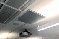 A 2¿ x 2¿ tile mounted to the ceiling to provide microphone coverage over student seating