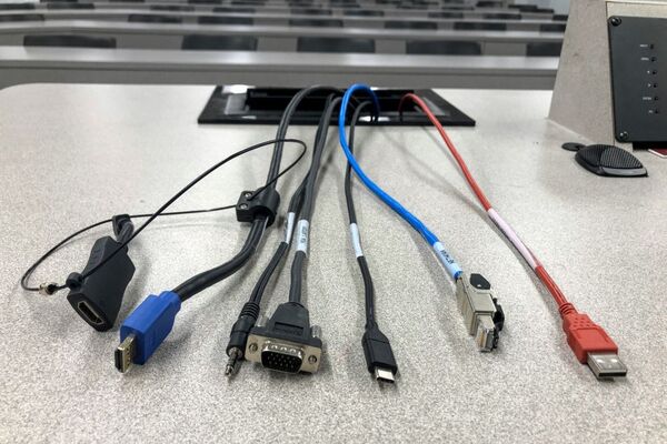 Pedestal - laptop cable connections with cables pulled out showing cable ends