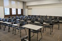 Back of room view of tables and chairs