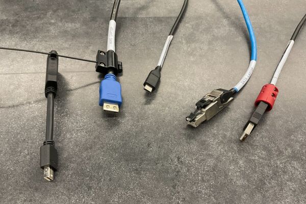 Pedestal - laptop cable connections with cables pulled out showing cable ends