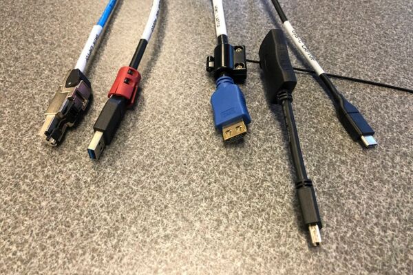 Pedestal - laptop cable connections with cables pulled out showing cable ends