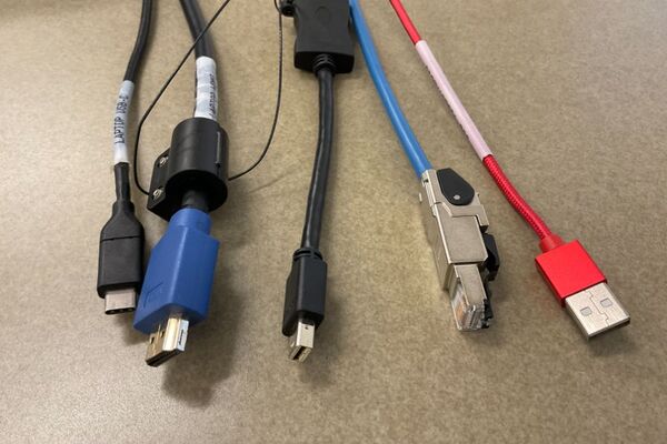 Pedestal - laptop cable connections with cables pulled out showing cable ends