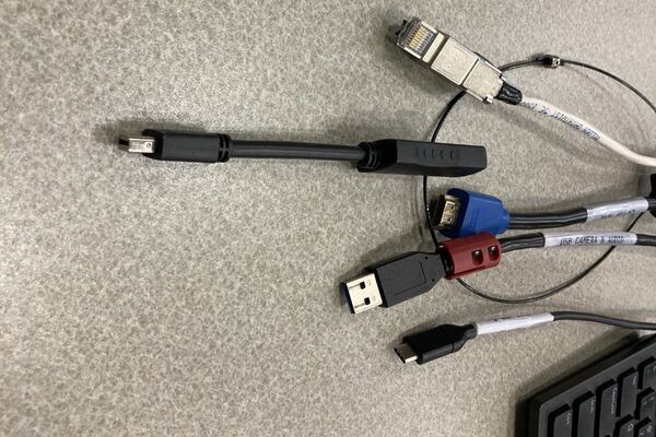 Pedestal - laptop cable connections with cables pulled out showing cable ends