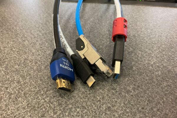 Pedestal - laptop cable connections with cables pulled out showing cable ends