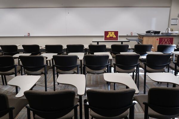 Front of room view with lectern on right in front of markerboard 