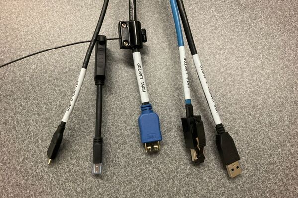 Pedestal - laptop cable connections with cables pulled out showing cable ends