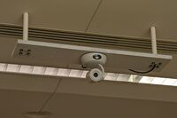 Camera mounted to ceiling and instructor enabled adjustments to the lens to allow the instructor to be "seen" by the camera in more locations around the room