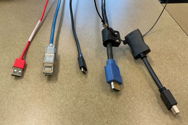 Pedestal - laptop cable connections with cables pulled out showing cable ends