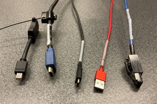 Pedestal - laptop cable connections with cables pulled out showing cable ends